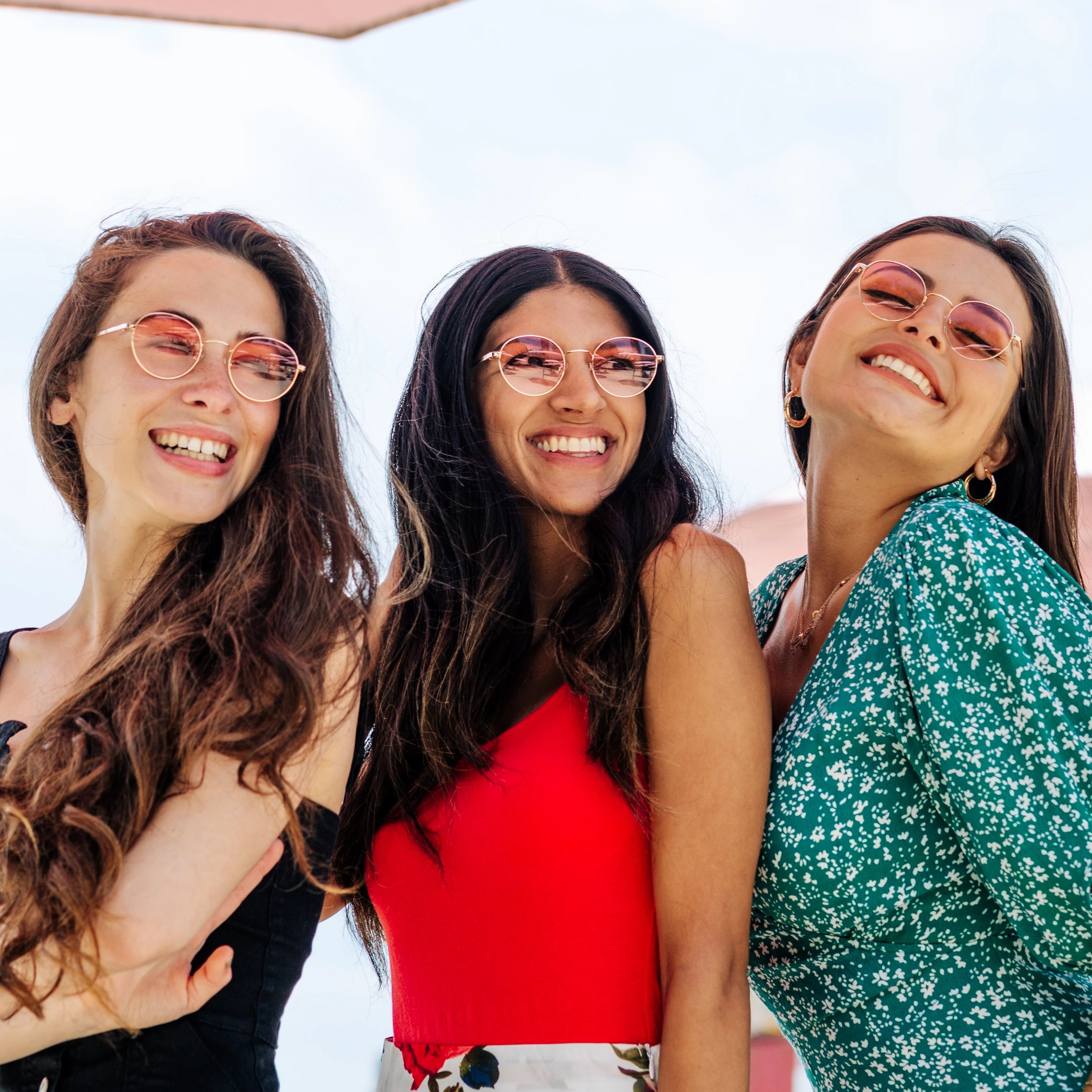 Women on the beach wearing Callula Co. petite sunglasses