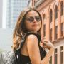Woman wearing Callula Co. havana tortoise petite sunglasses