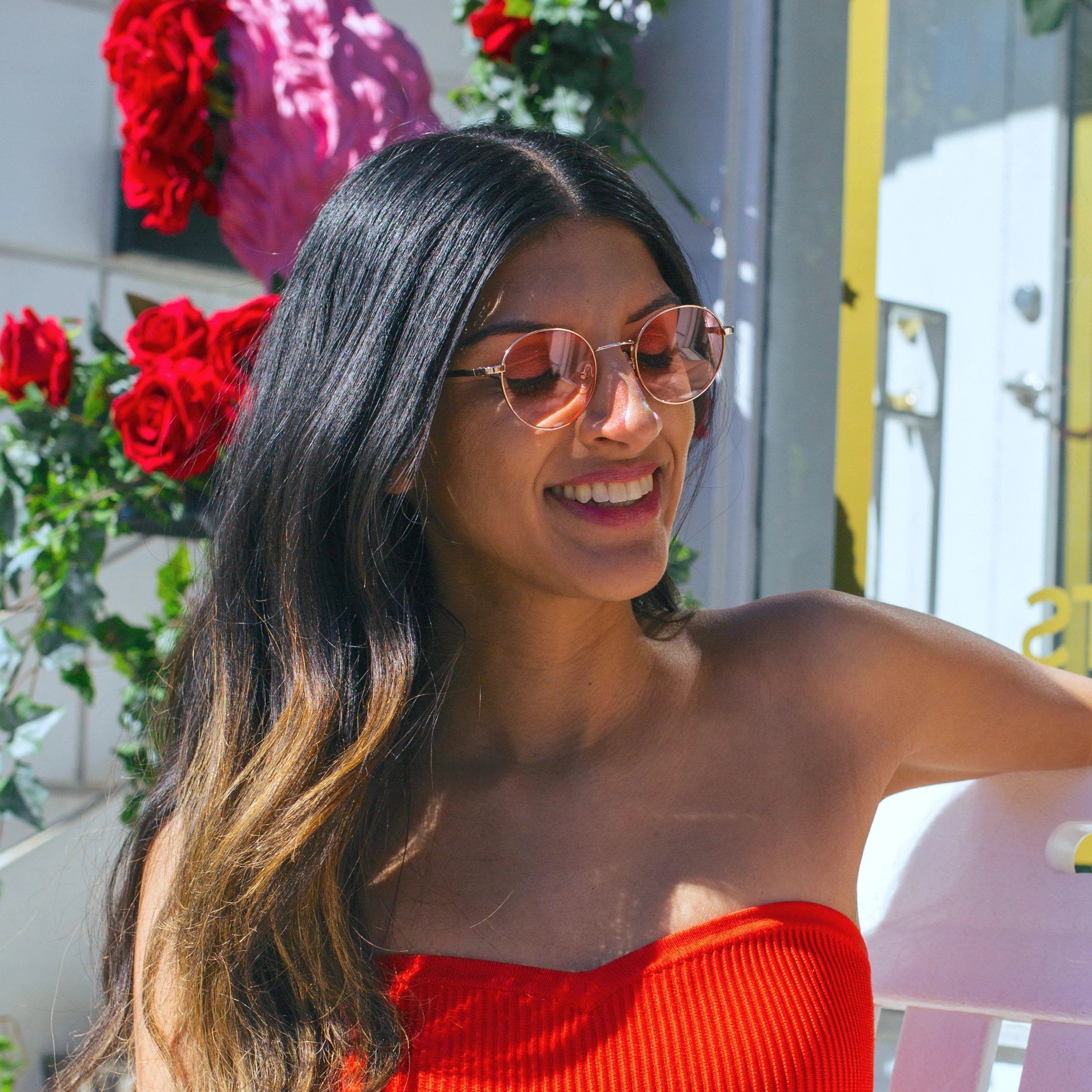 Woman smiling wearing Callula Co. petite sunglasses